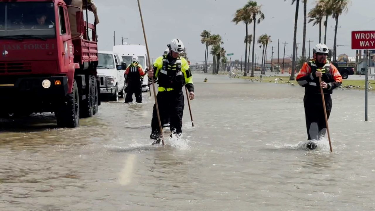 Members of Texas A&M Task Force 1 conduct welfare checks in Corpus Christi, Texas, on Thursday.