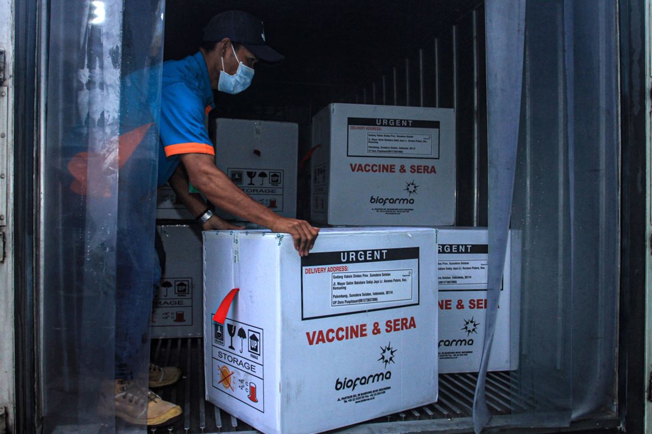 A health officer unloads boxes of Sinovac's Covid-19 vaccine in Palembang, Indonesia on January 4.