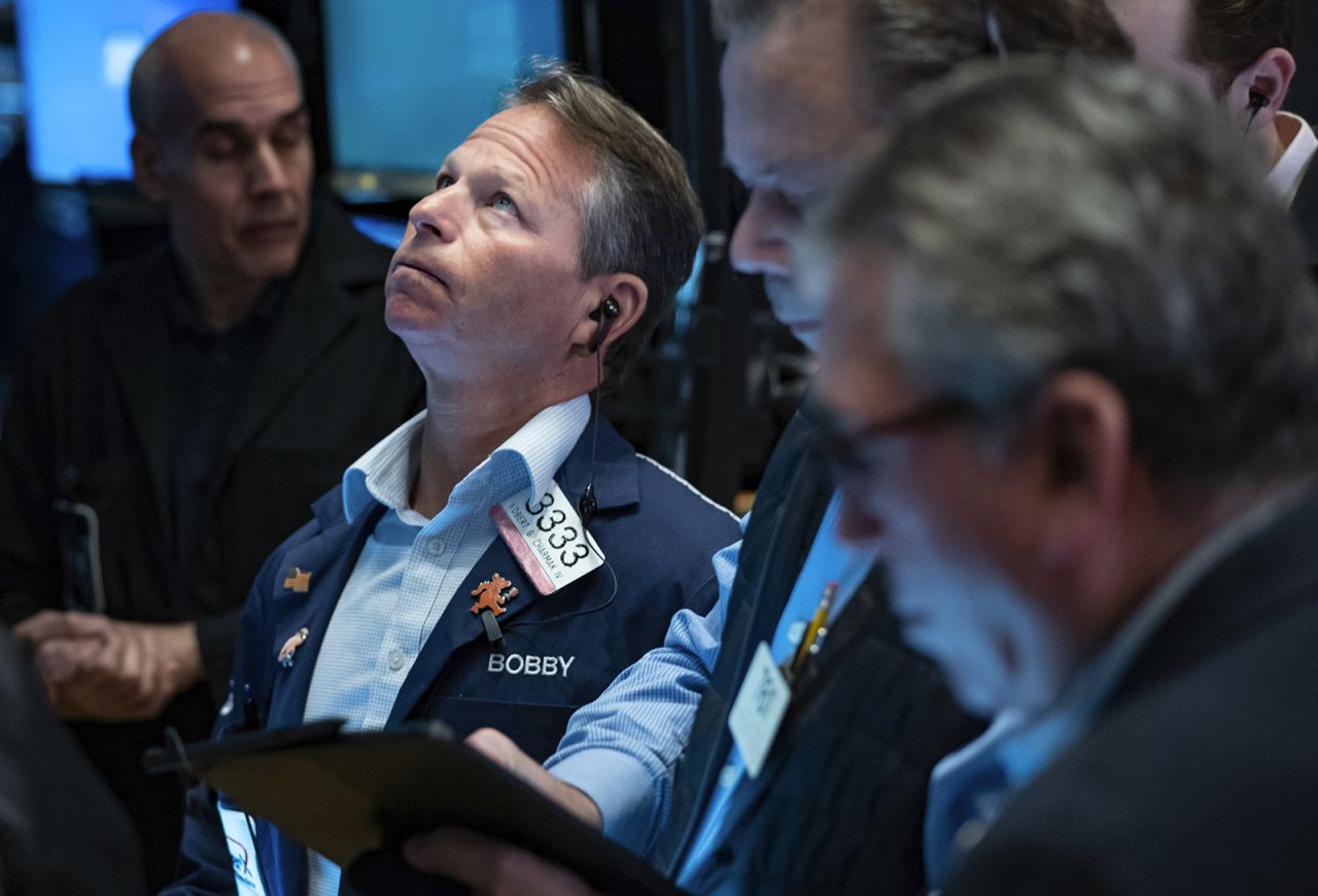 Traders work on the floor at the New York Stock Exchange in New York, Monday, March 13, 2023. 