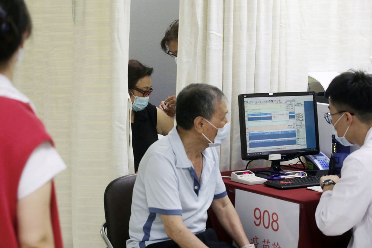 A person is administered with a dose of the Covid-19 vaccine at a vaccination center in New Taipei City, Taiwan, on May 13.