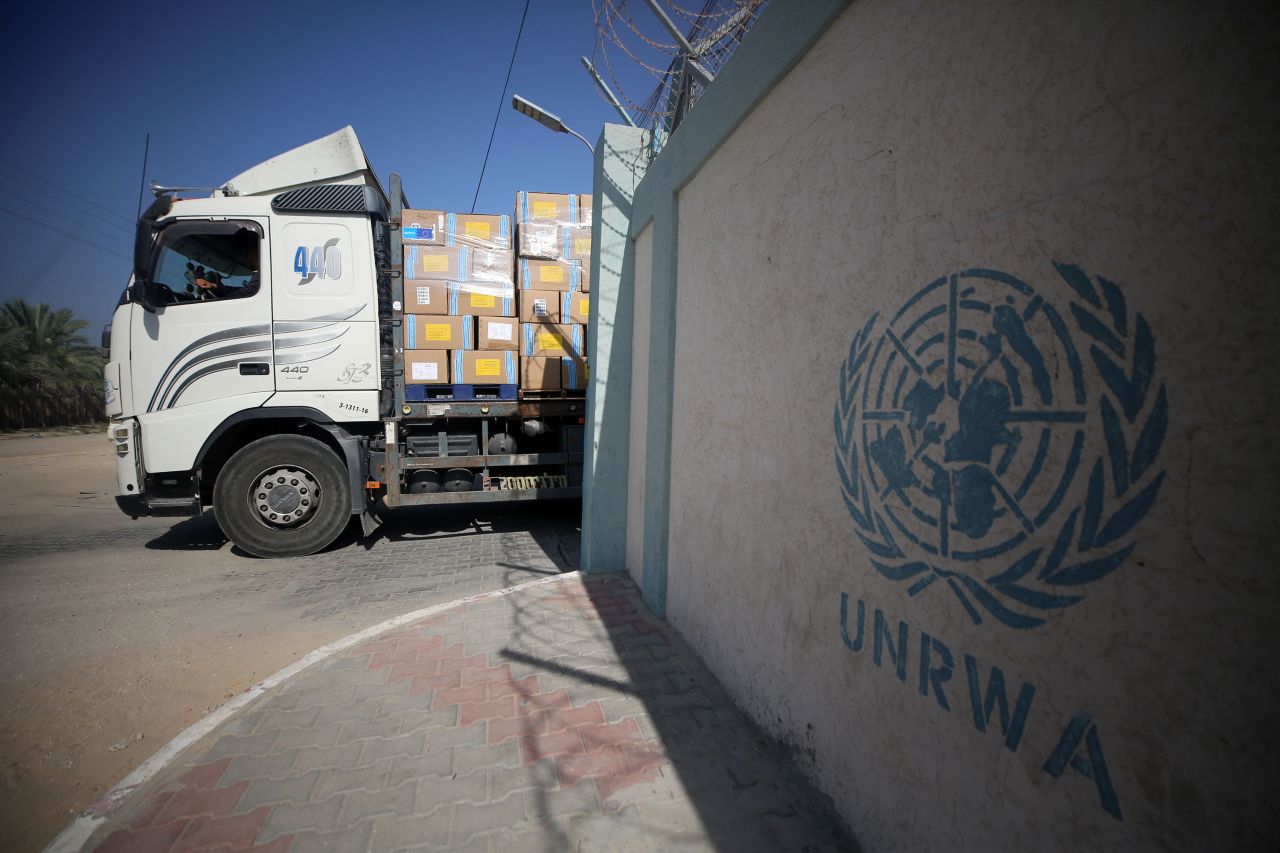 Workers of the United Nations Relief and Works Agency for Palestine Refugees (UNRWA) transport aid in Deir Al-Balah, Gaza, on October 25. 