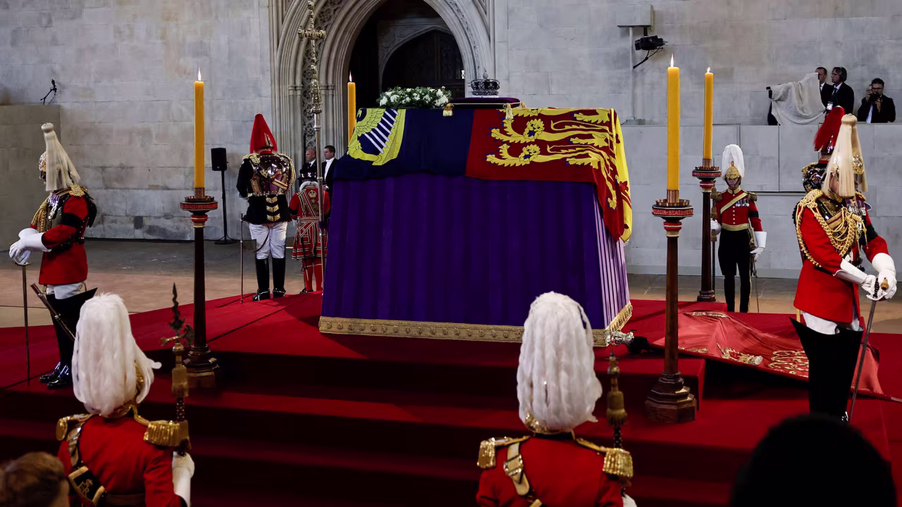The coffin of Queen Elizabeth II, adorned with the Imperial State Crown, rests on a raised platform inside London's Westminster Hall on Wednesday, September 14.