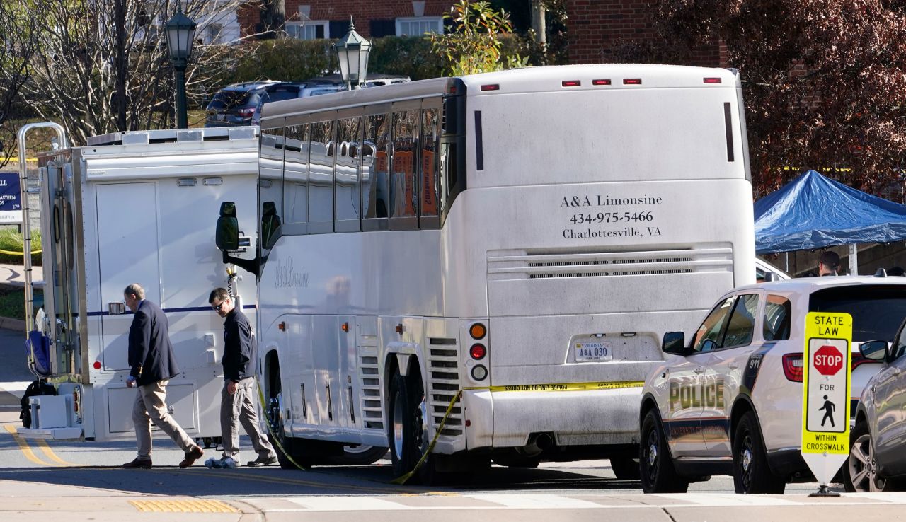 Police investigators work around the bus at the site of the shooting at the University of Virginia on Monday.