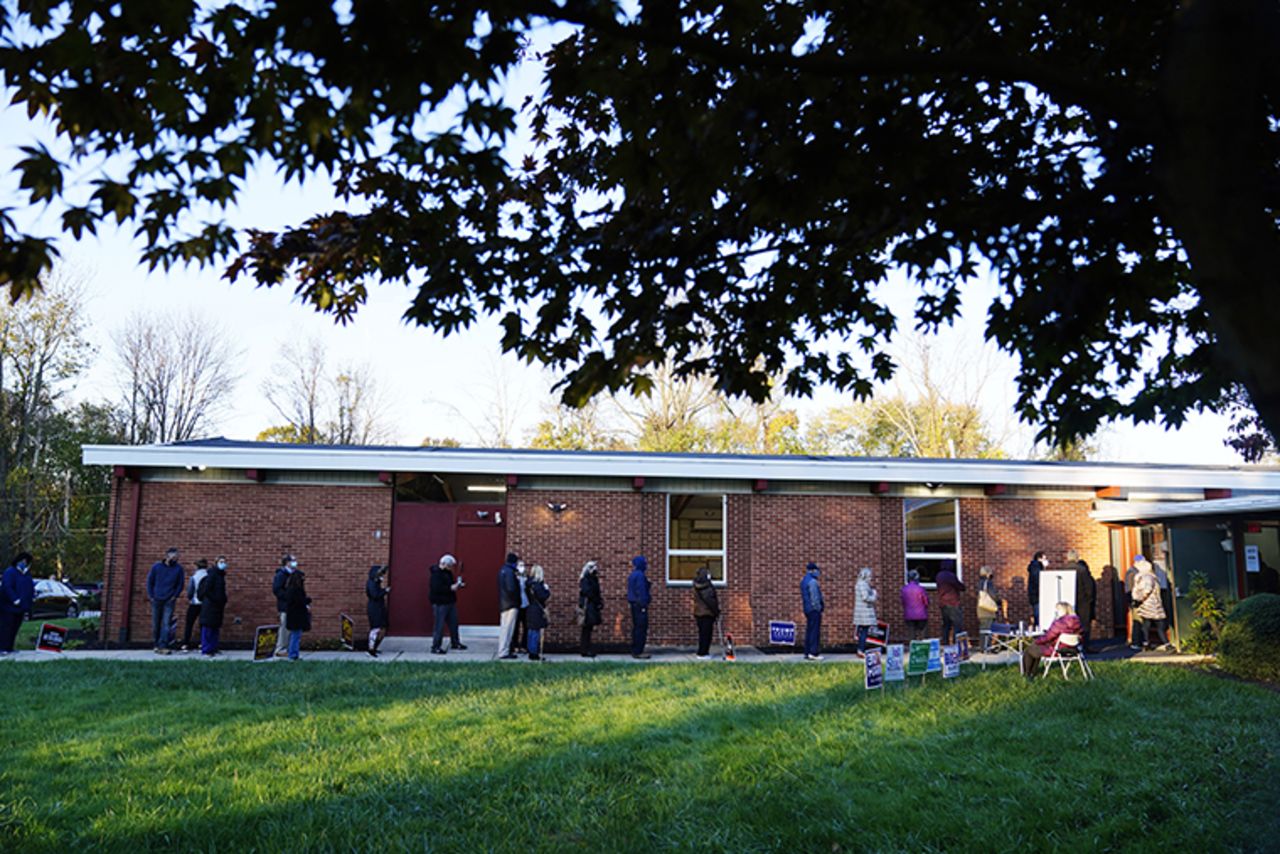 People line up outside a polling place to vote in the 2020 general election in the United States, Tuesday, Nov. 3, 2020, in Springfield, PA.