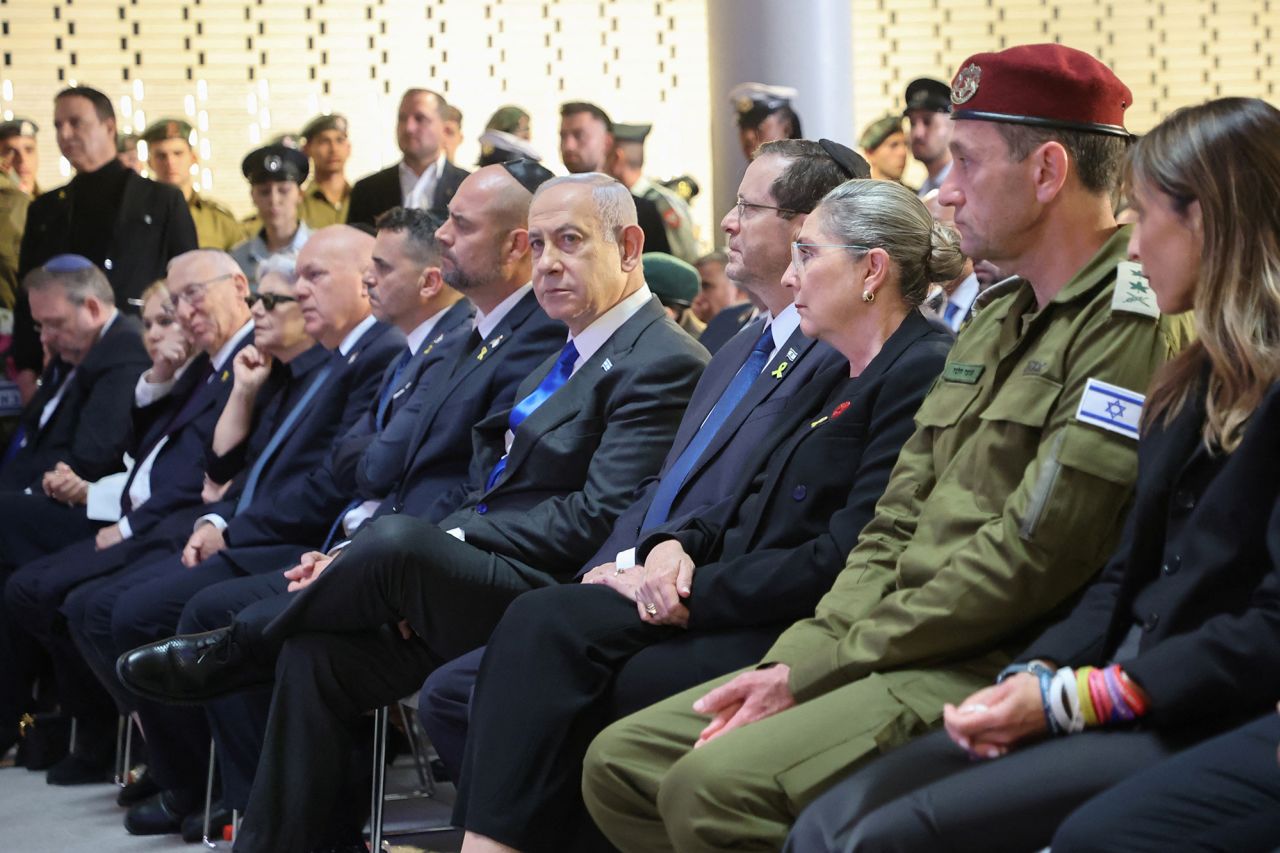 Israeli Prime Minister Benjamin Netanyahu, President Isaac Herzog and his wife Michal Herzog, and Chief of the General Staff Herzi Halevi attend a ceremony marking national Memorial Day for fallen soldiers of Israel's wars and victims of attacks, at Jerusalem's Mount Herzl military cemetery, on May 13.