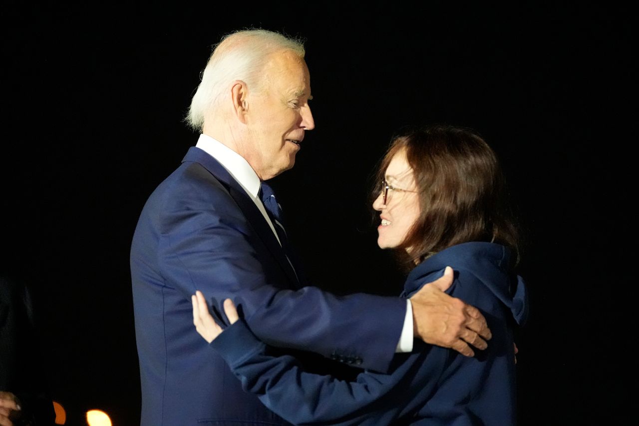 President Joe Biden greets Alsu Kurmasheva at Joint Base Andrews on Thursday.