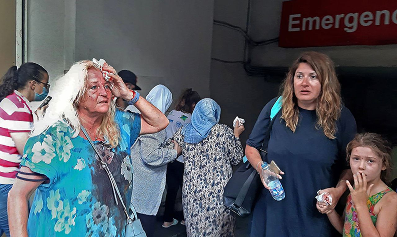 Valarie Fakhoury, a British grandmother with her Lebanese daughter and granddaughter, stand outside the emergency ward of a hospital in central Beirut.