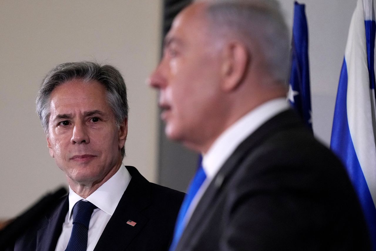 U.S. Secretary of State Antony Blinken looks on as Israel’s Prime Minister Benjamin Netanyahu makes a statement to the media inside The Kirya in Tel Aviv, Israel, on October 12.