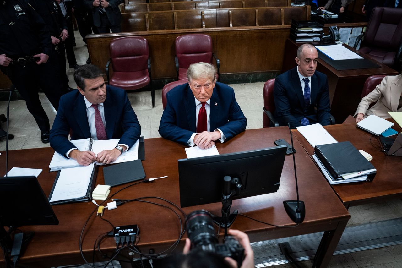 Former President Donald Trump appears with his legal team Todd Blanche, left, and Emil Bove, right, ahead of the start of jury selection at Manhattan Criminal Court on April 15, in New York City.