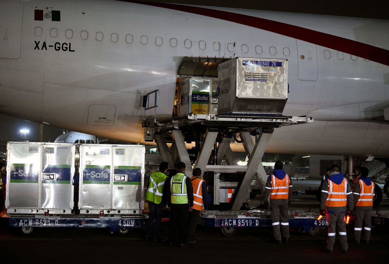 Employees unload shipping containers of the AstraZeneca Covid-19 vaccine at Benito Juarez International Airport in Mexico City, on March 28. 