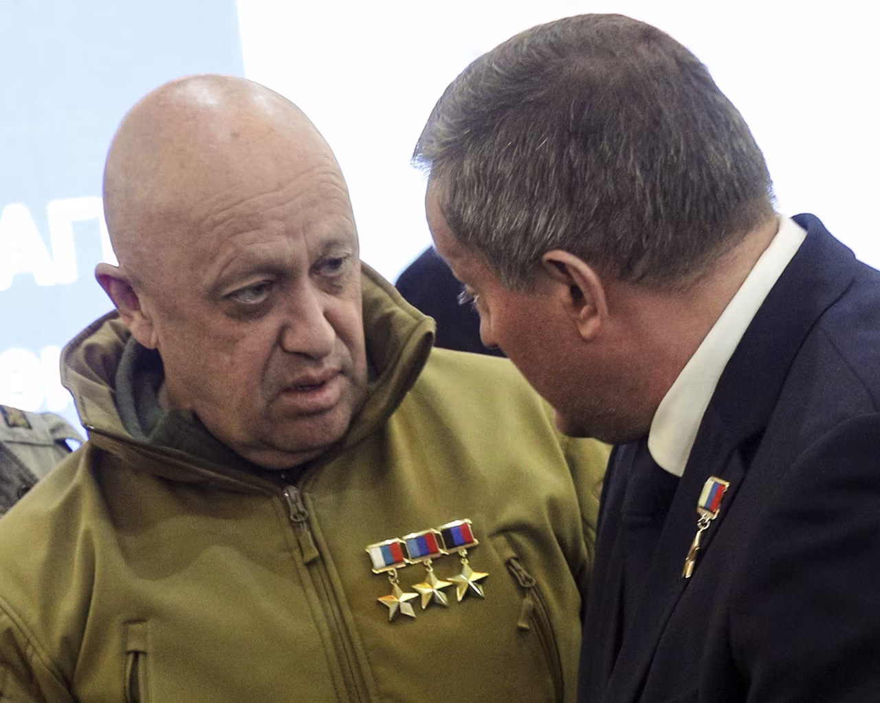 Wagner Group leader Yevgeny Prigozhin, left, and Governor of the Volgograd Region Andrey Bocharov attend a farewell ceremony for Wagner PMC soldier Alexei Nagin in Volgograd, Russia, on September 24.