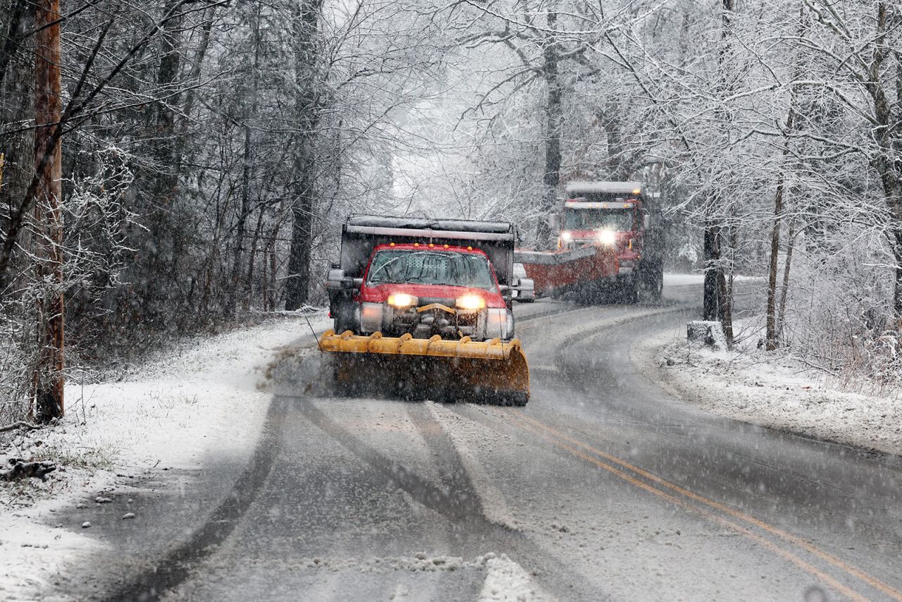 The West Bridgewater Department of Public Works plows a street on Tuesday in West Bridgewater, Massachusetts. 
