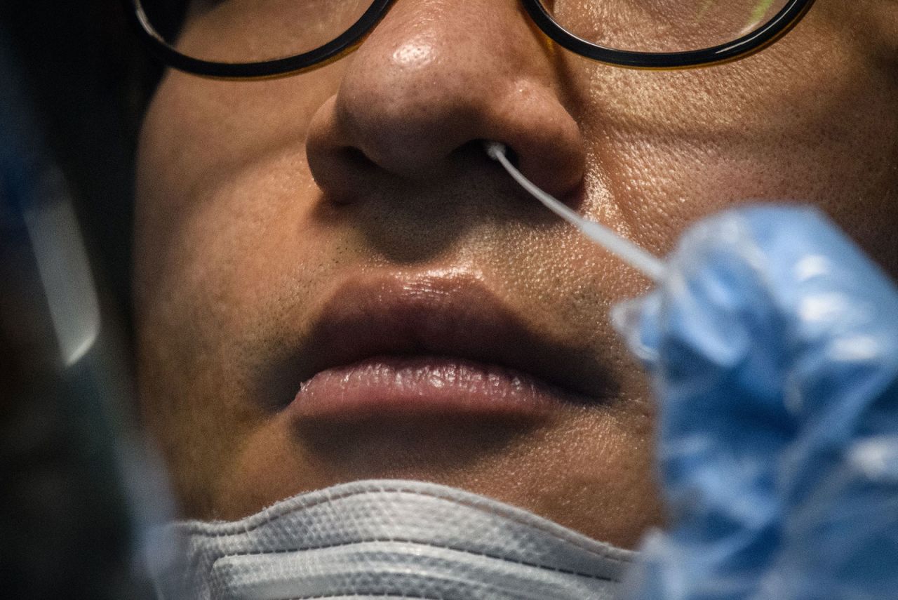 A man receives a Covid-19 test swab at a testing booth outside the Yangji Hospital in Seoul, South Korea on March 17. 