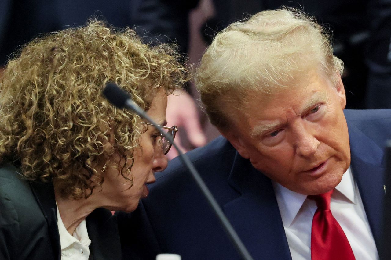 Former President Donald Trump speaks with his lawyer during a court hearing Manhattan Criminal Court in New York on Thursday.