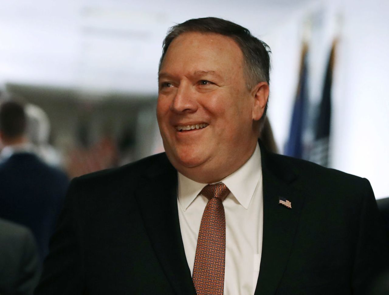 CIA Director Mike Pompeo smiles as he walks to a meeting with Sen. Mark Warner (D-VA) on Capitol Hill on Wednesday in Washington, DC. President Donald Trump has nominated Pompeo to become the next Secretary of State.