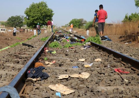 The belongings of victims are scattered on the railway track after a train ran over migrant workers sleeping in the Aurangabad district of Maharashtra, India, on May 8.