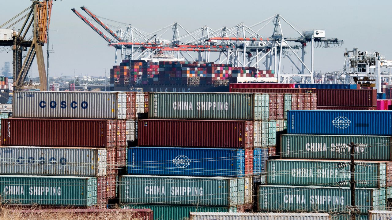 Shipping containers from China and other Asian countries are unloaded at the Port of Los Angeles as the trade war continues between China and the US, in Long Beach, California on September 14, 2019.