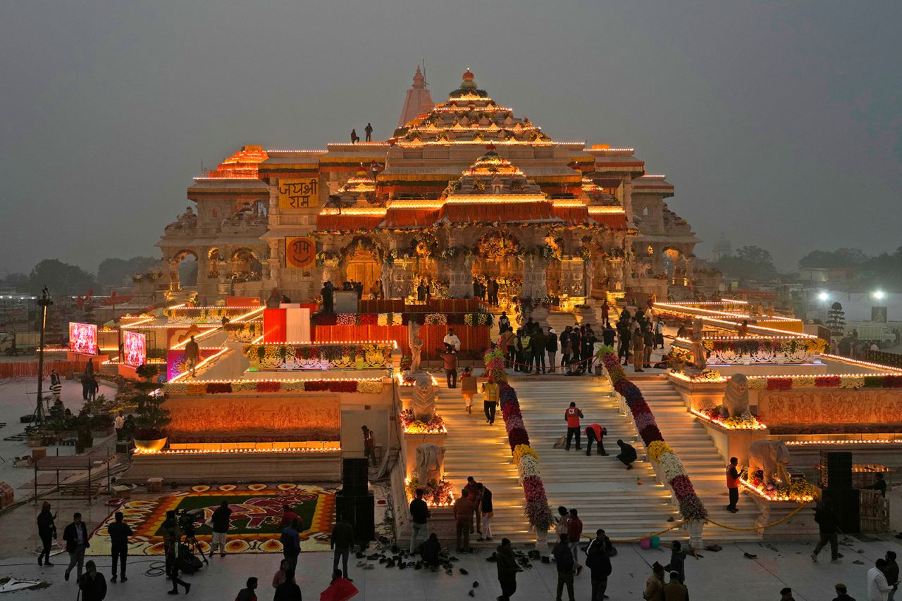 Workers decorate a temple dedicated to Hindu deity Lord Ram the day before it's grand opening in Ayodhya, India, on January 21.