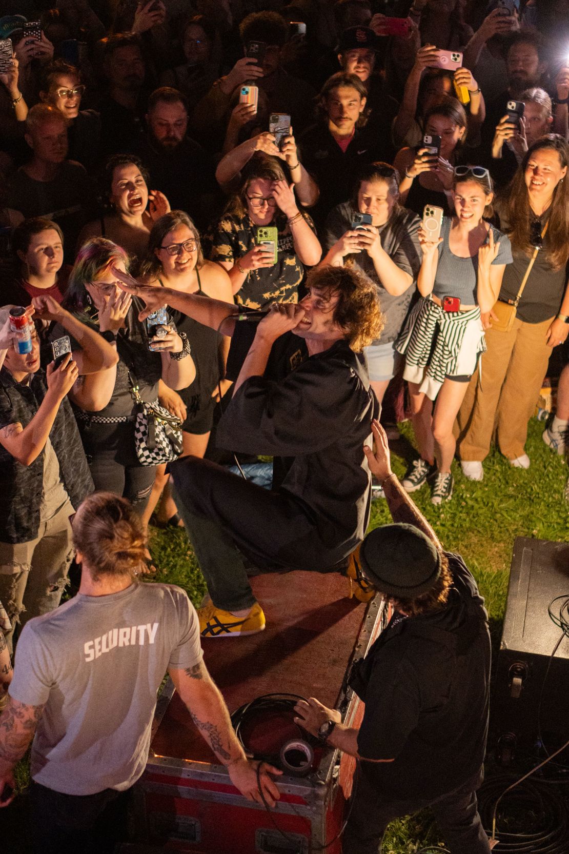 Tyson Ritter jumping atop a storage crate during a House Party Tour show in Columbia, Missouri, in May.