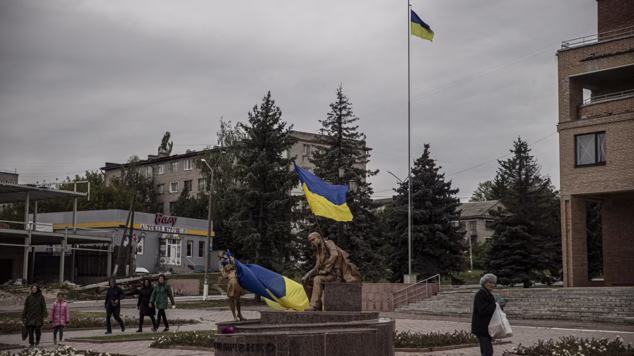 Ukrainian flags wave in the liberated town of Balakliya on Sunday.