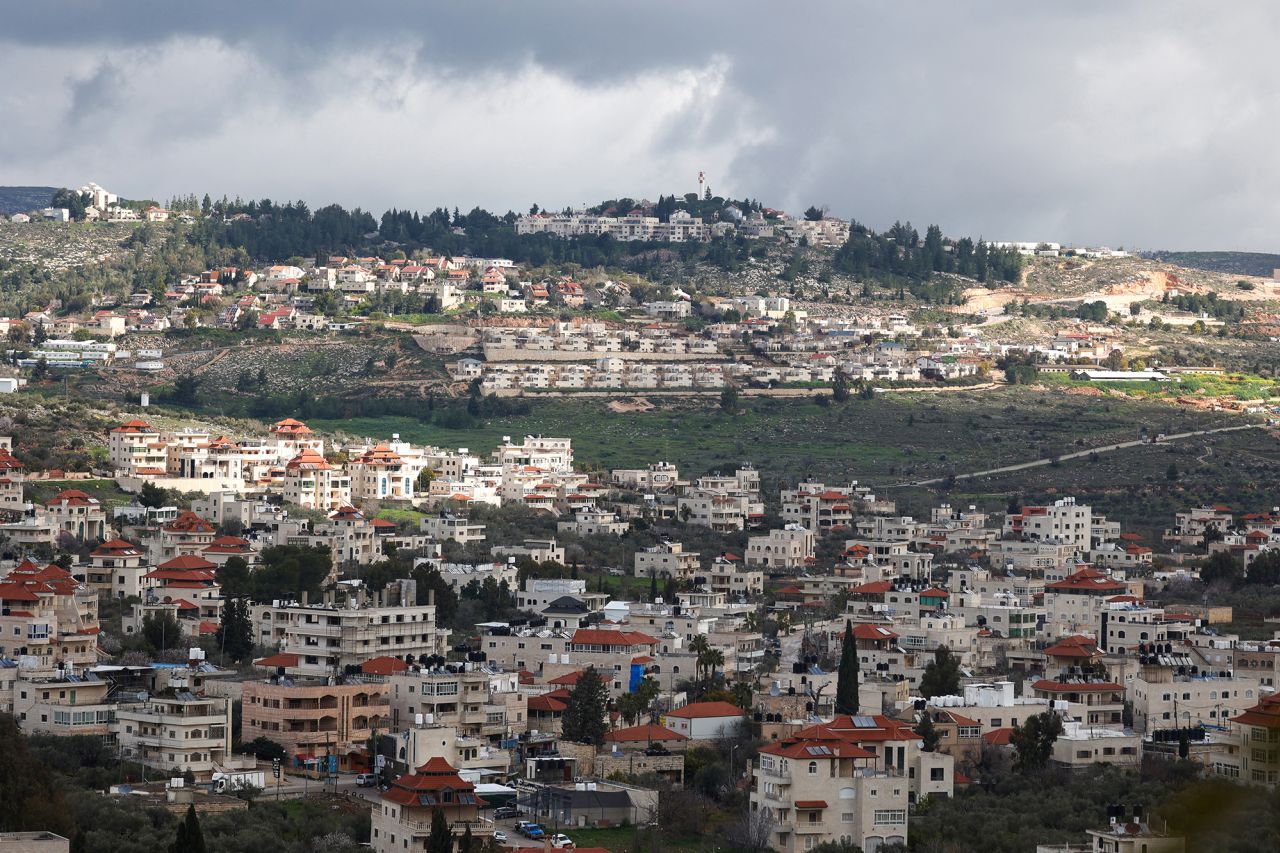 A picture taken in the village of Turmus Ayya near Ramallah city shows the nearby Israeli Shilo settlement in the background, in the occupied West Bank on February 18.