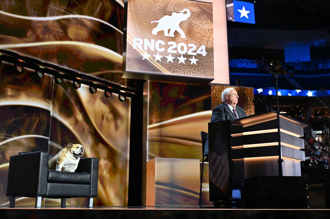 West Virginia Governor Jim Justice speaks alongside his bulldog "Babydog" during the second day of the 2024 Republican National Convention at the Fiserv Forum in Milwaukee, Wisconsin, July 16.