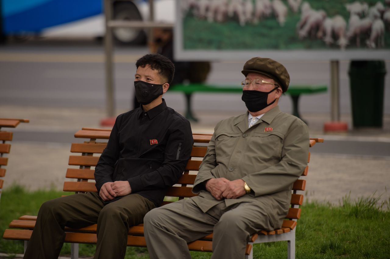 People watch a screen showing a broadcast in Pyongyang on May 2.