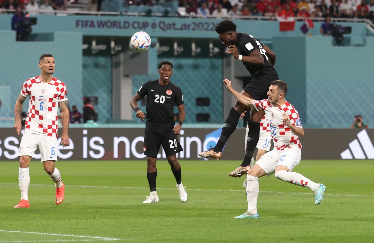 Canada's Alphonso Davies heads the ball to score against Croatia on Sunday, November 27. 