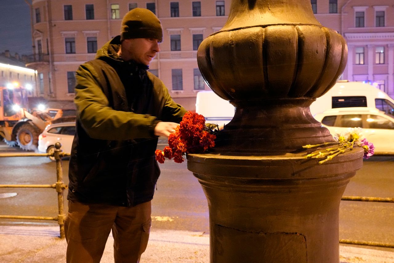 A man lays flowers near the site of an explosion in St. Petersburg, Russia, on April 2.