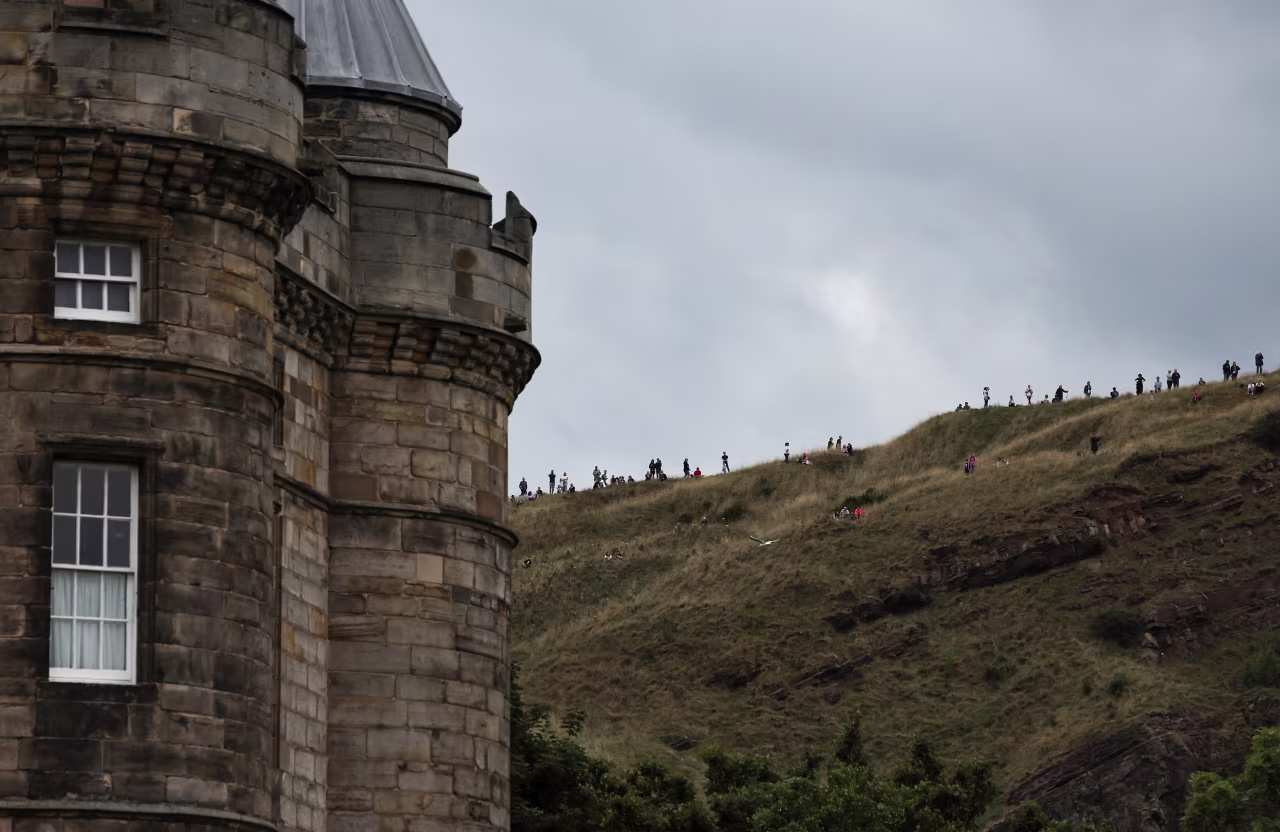 People wait for the hearse's arrival in Edinburgh.