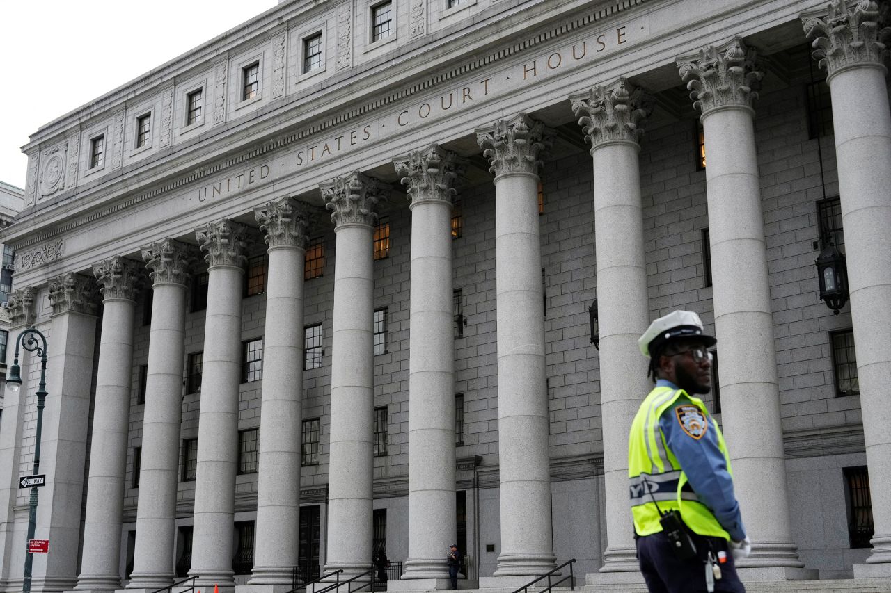 An NYPD officer stands guard before former President Donald Trump is expected to arrive at a federal appeals court in New York on Friday.