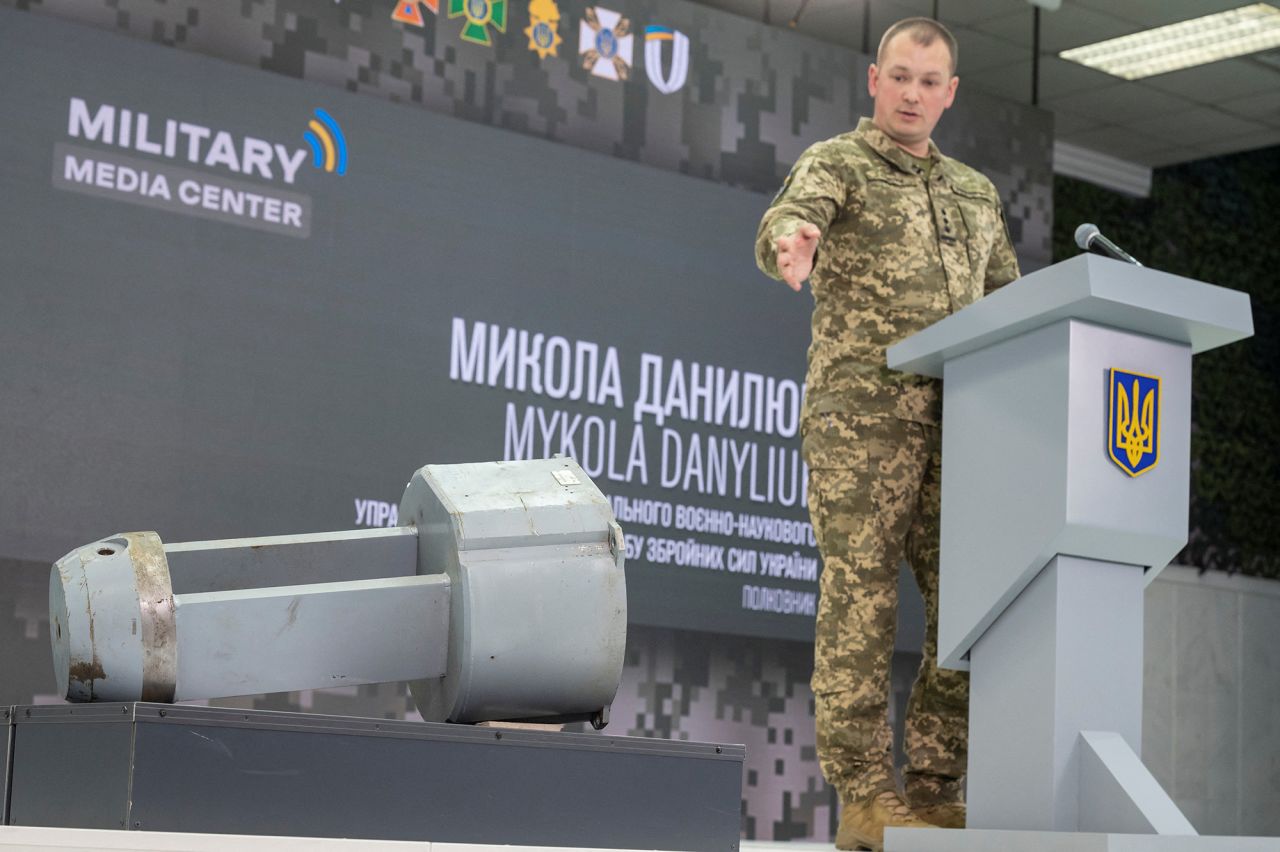 Colonel?Mykola?Danyliuk points at a dud warhead imitating a nuclear part of a Kh-55SM strategic cruise missile, during a news conference in Kyiv, Ukraine, on December 1.