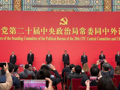 New members of the Politburo Standing Committee are introduced at the Great Hall of the People in Beijing on Sunday.