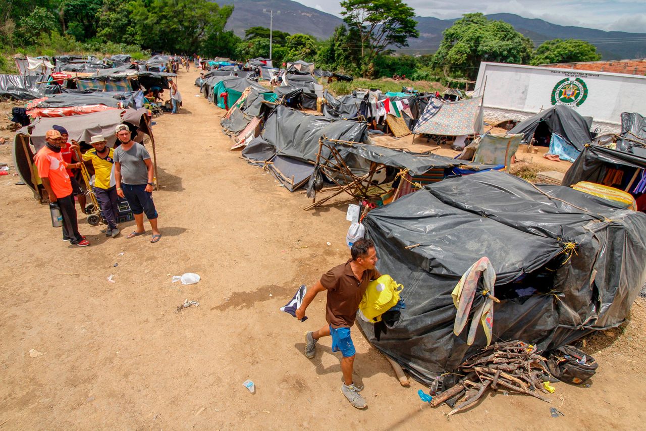 Venezuelan migrants attempting to return to their country due to the Covid-19 pandemic remain in makeshift camps at the Simon Bolivar International Bridge in Cucuta, Colombia, on July 7.