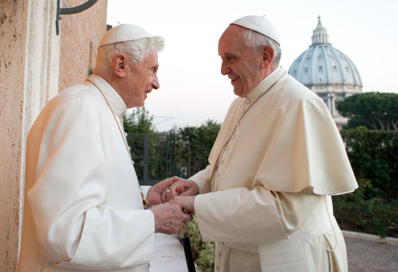 Pope Benedict XVI exchanges Christmas greetings with his successor, Pope Francis, at the Vatican in December 2013. 