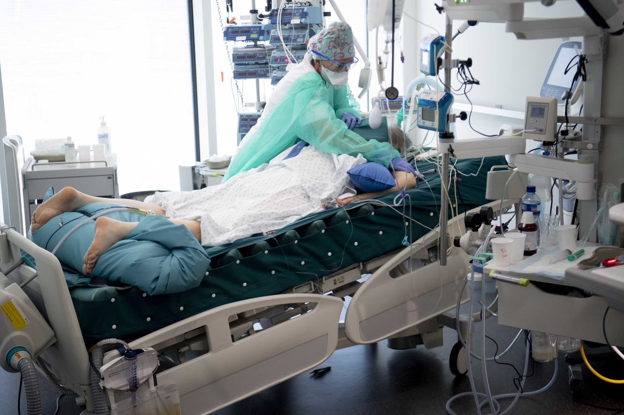 A medical worker treats a coronavirus patient at a hospital in Rennaz, Switzerland, on April 8.