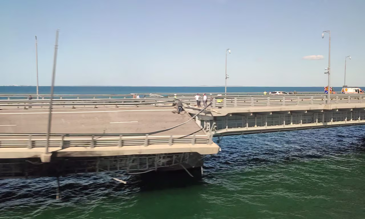 This video grab shows the section of a road split and sloping to one side following an alleged attack on the Crimea Bridge, that connects the Russian mainland with the Crimean peninsula across the Kerch Strait, on July 17.