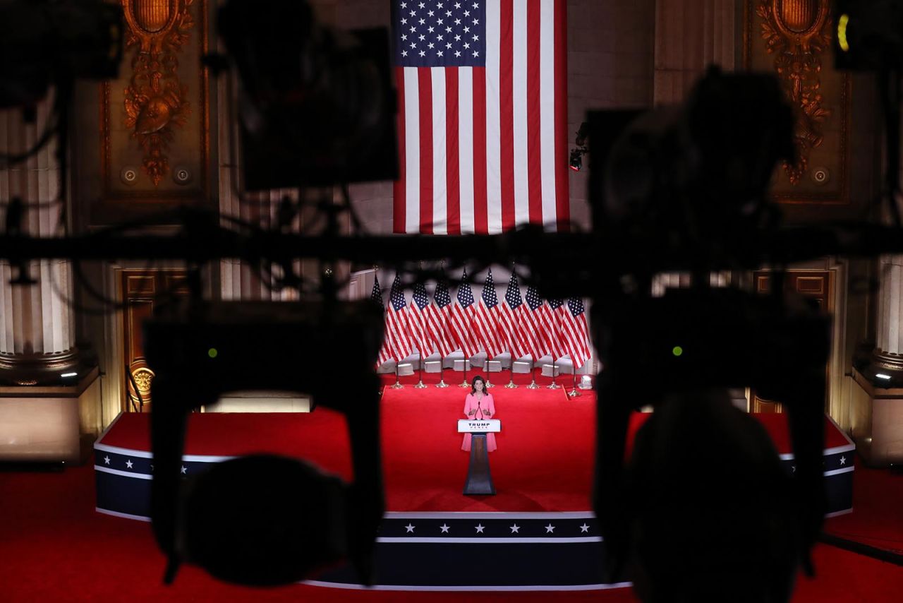 Former U.S. Ambassador to the United Nations Nikki Haley stands on stage in an empty Mellon Auditorium while addressing the Republican National Convention on Monday in Washington.