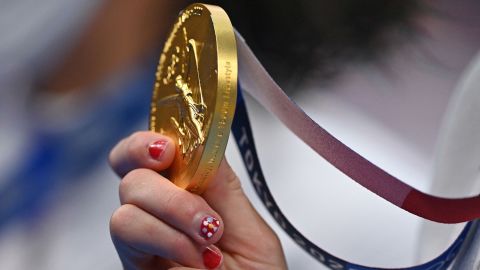 USA's Kathleen Ledecky holds her gold medal after winning the 1500m freestyle swimming event on July 28.