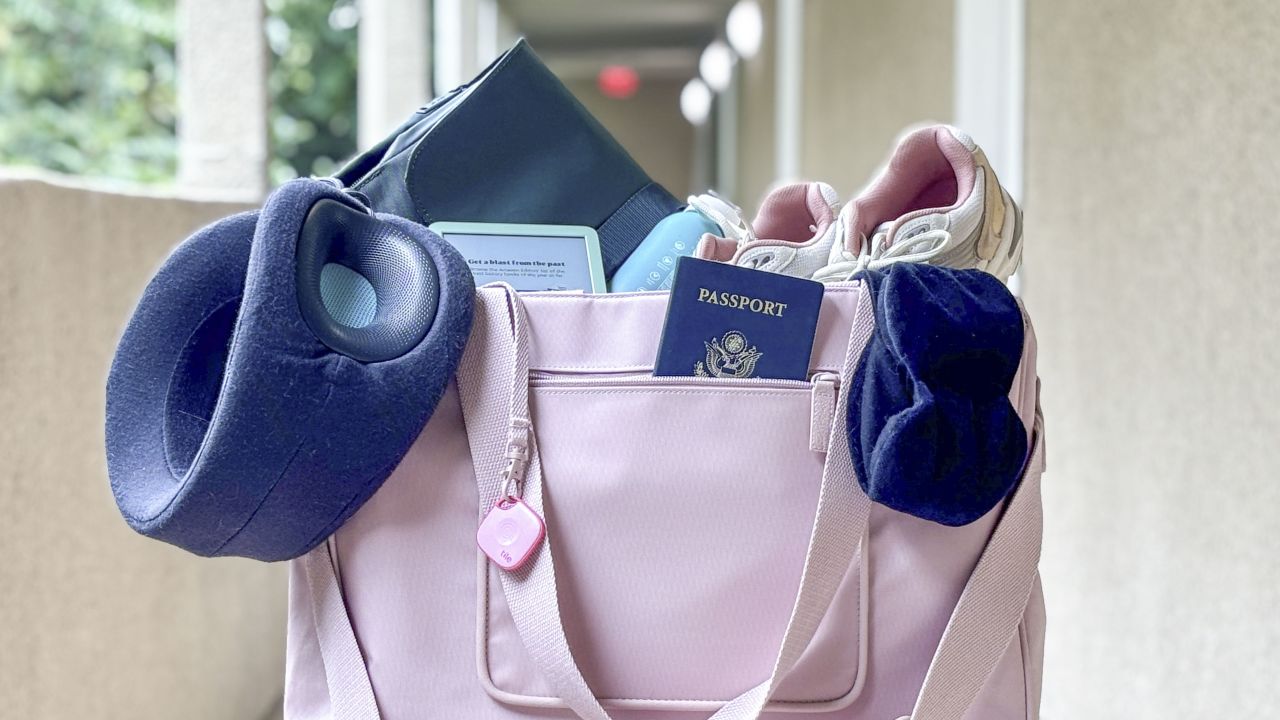 A weekender bag full of accessible travel accessories