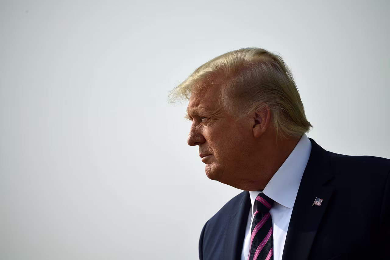 President Donald Trump speaks to the press on the tarmac as he arrives in McClellan Park, California, on Monday. 