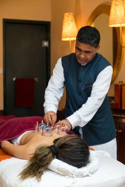 A person undergoes a cupping treatment as part of the "hormonal rebalance" program.