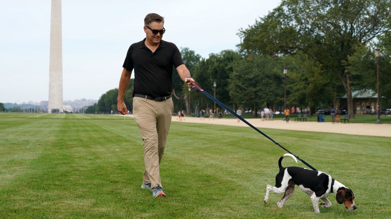 CNN’s Jim Acosta with his rescue dog Duke on the National Mall in Washington, DC, on Friday, August 25, 2023.