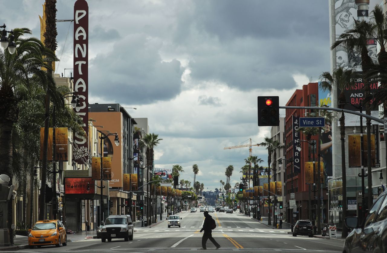 A man crosses Hollywood Boulevard in Los Angeles, California, on March 25.