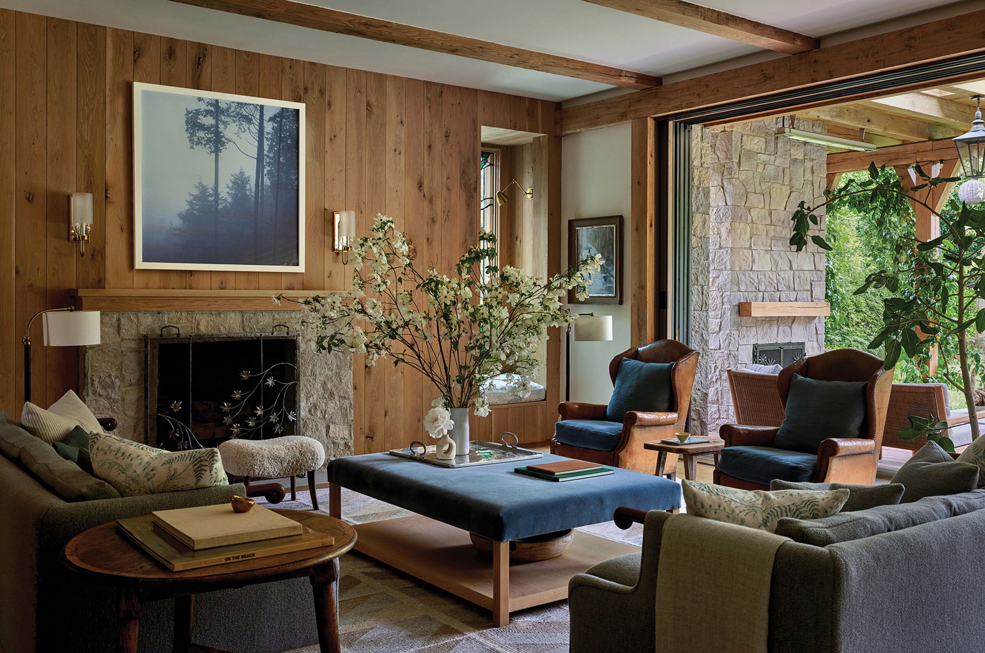 The mood is cozy but elevated in Jennifer Garner's living room, which is filled with antique and repurposed pieces as well as a custom coffee table, and opens up to her verdant yard.