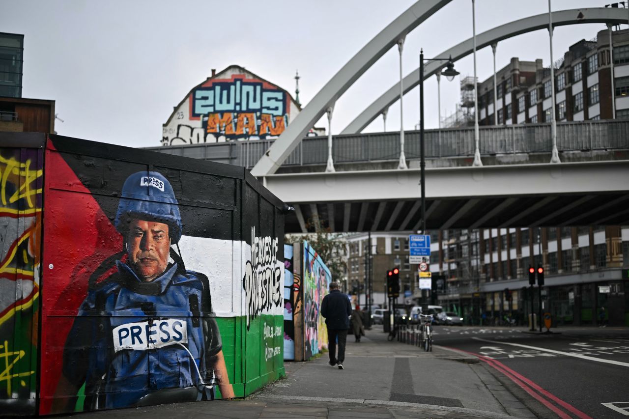 A mural by Spanish street artist Nacho Welles, also known as Core246, depicts Palestinian journalist and Al Jazeera's Gaza City bureau chief Wael al-Dahdouh, on January 29, in London.