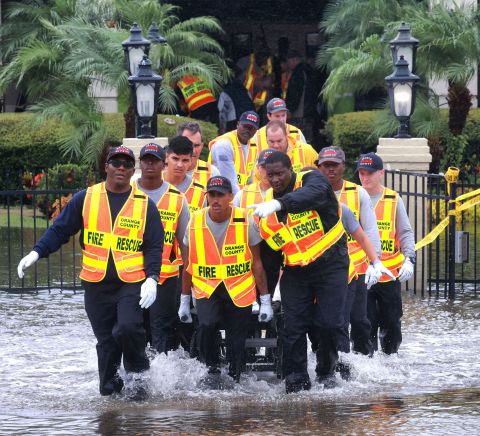 Rescuers evacuate residents from an assisted living facility in Orlando on Thursday.