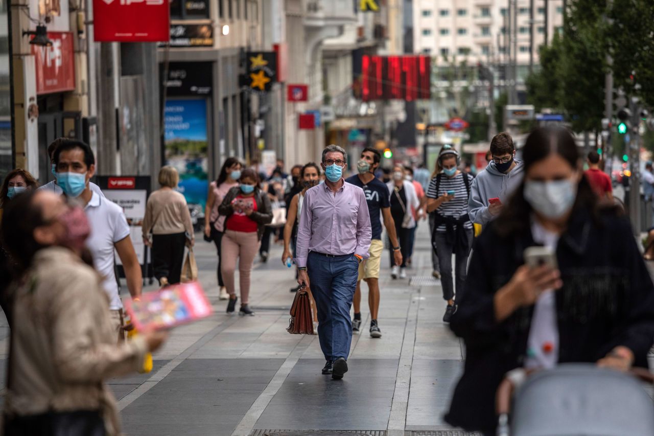 People walk in downtown Madrid on September 17.