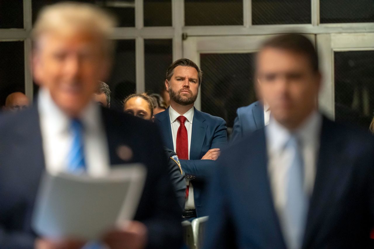 Sen. JD Vance looks on as former President Donald Trump speaks to the media during Trump's trial for allegedly covering up hush money payments at Manhattan Criminal Court on May 13 in New York City. 