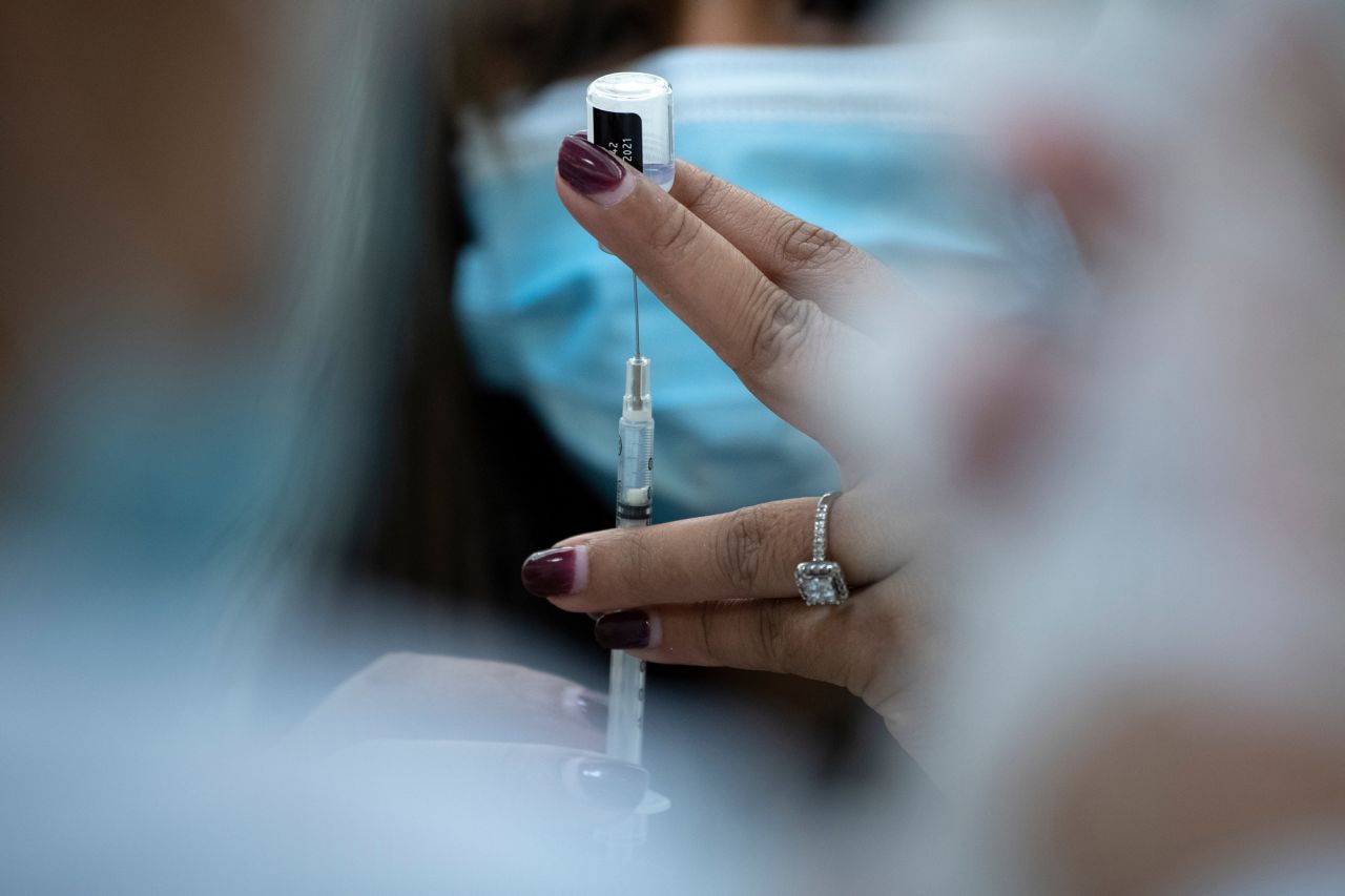 A pharmacist prepares to administer the Pfizer COVID-19 vaccine at the Goodwin House Bailey's Crossroads in Falls Church, Virginia, on December 30, 2020. 